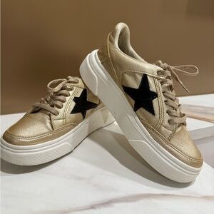 Chic Gold Sneakers with Black Star Accent